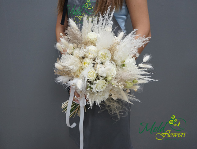 Bridal bouquet of white roses, eustoma, dahlia, and lagurus photo